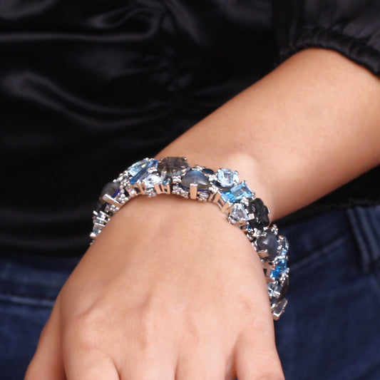 Garden of Stephen Carved Tahitian Mother of Pearl London Blue Topaz Swiss Blue Topaz and Labradorite Open and Close Bangle in Sterling Silver